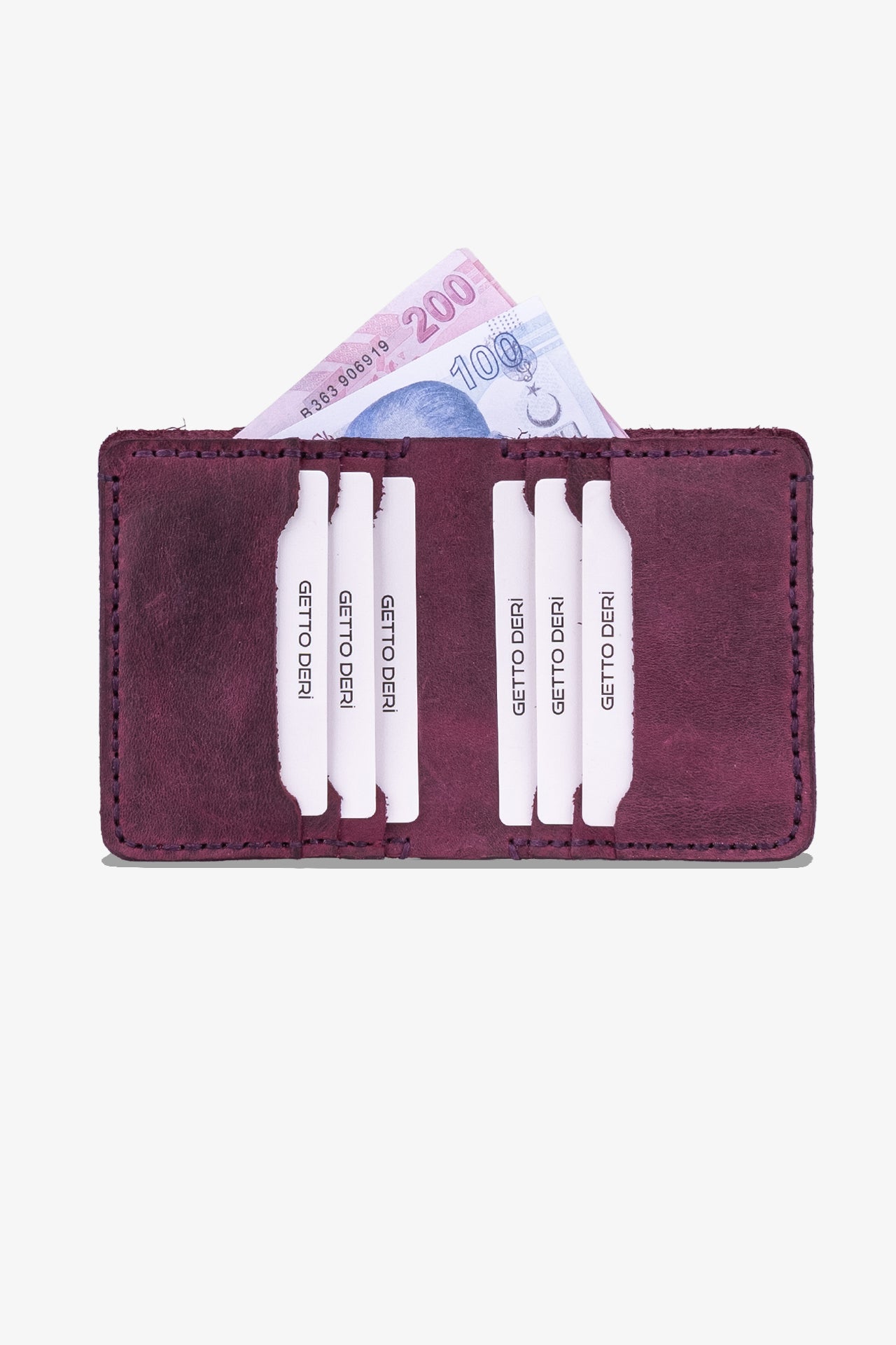 Bordo deri cüzdan, kartlık ve Türk lirası banknotları içeren kompakt tasarımlı ürün