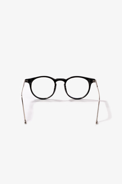 Siyah oval çerçeveli gözlük, metal kollarla